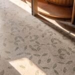 Flooring detail of the fallen leaf pattern in green glass chips at FoK Library, Mumbai by Studio Hinge