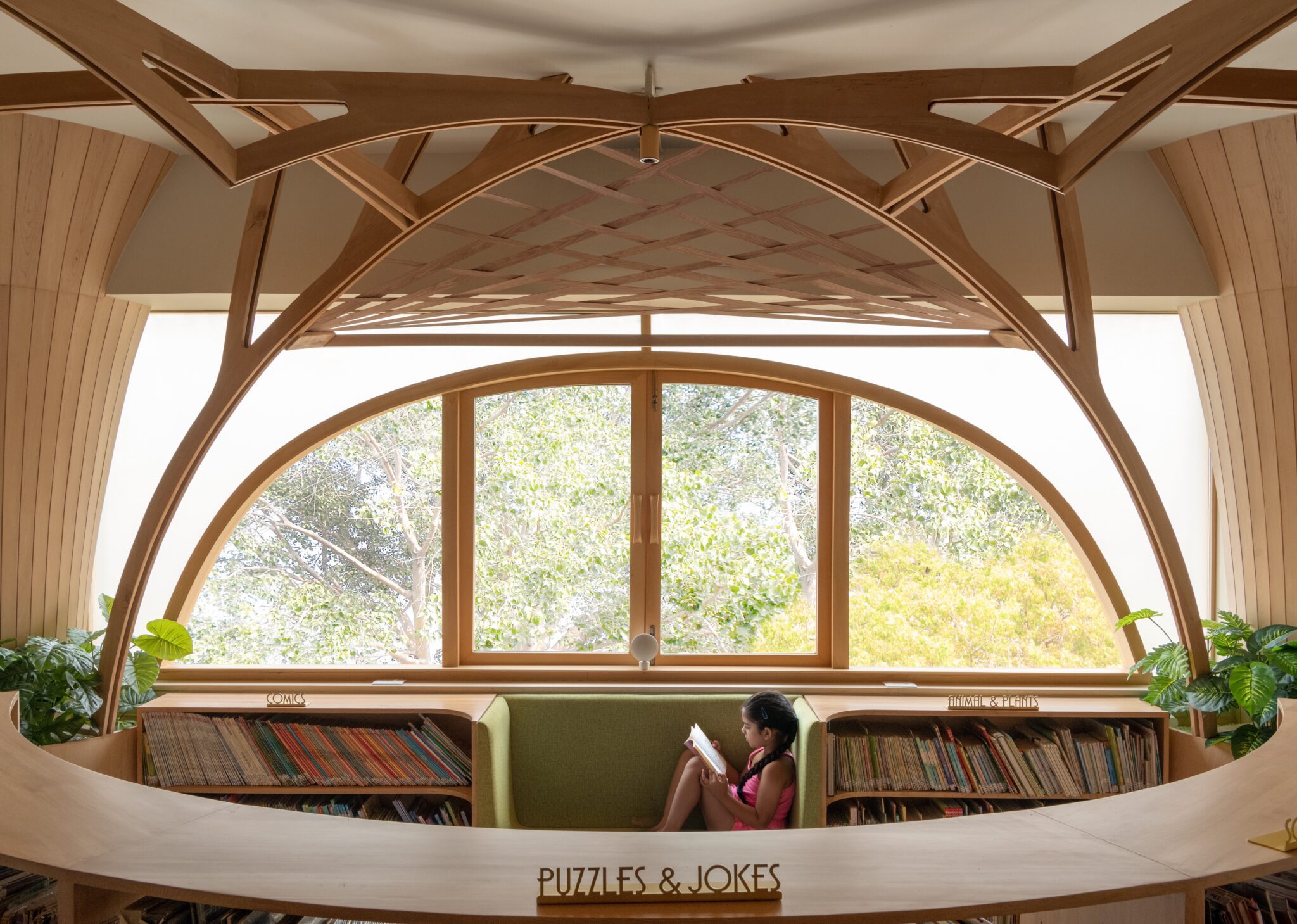 Built-in benches below windows offer informal seating at FoK Library, Mumbai by Studio Hinge