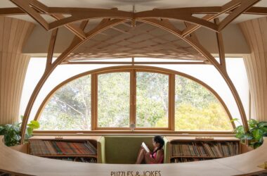 Built-in benches below windows offer informal seating at FoK Library, Mumbai by Studio Hinge