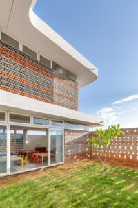 View from a classroom garden showing the seamless integration of outdoor space with functional learning areas.