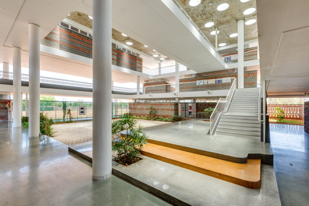 Wide-angle view of the covered central gathering space that runs through the entire length of the building.
