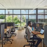 A specialized group-work pod located near the lobby, furnished with modern chairs and a low table for student collaboration
