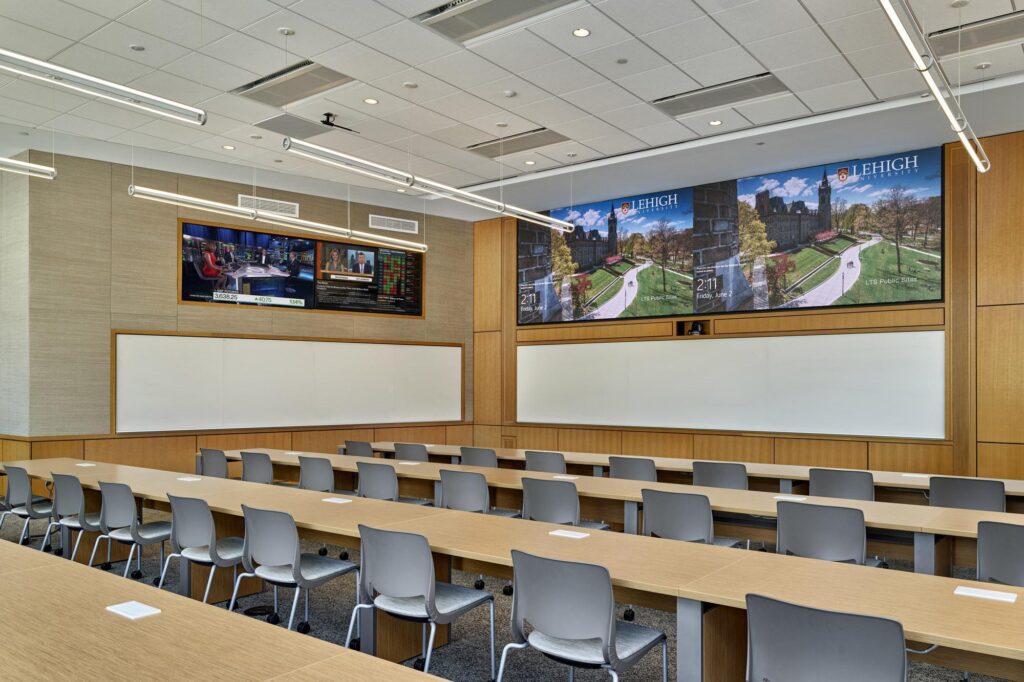 A specialized learning environment featuring multiple screens and workspace for early-stage entrepreneurs in the Lehigh Ventures Lab