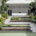 A view of the main central courtyard featuring terraced planters that serve as a vegetated gathering space