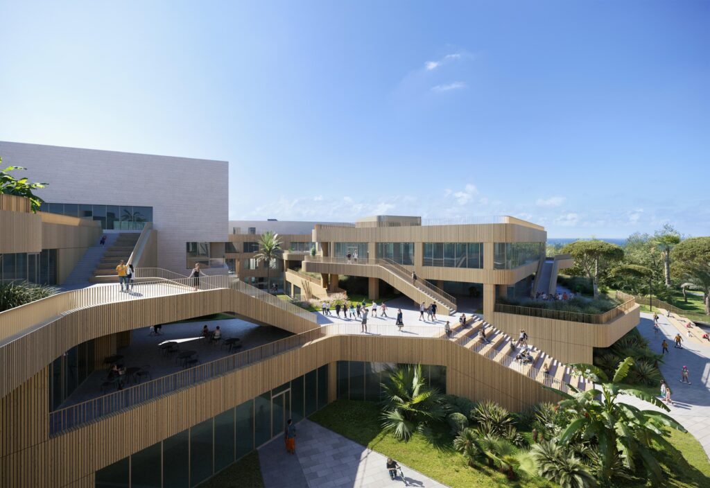 Rendering of a dynamic outdoor terrace featuring wide wooden staircases that function as cascading spectator seating and dining decks. Groups of students and teachers sit, walk, and dine on the terraces, which look out over a landscaped green park and dense tropical trees.