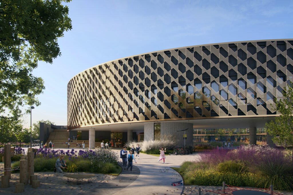 Ground-level exterior render showing school children running and playing in a landscaped courtyard beneath a curved, floating building volume clad in geometric, patterned gold perforated metal panels
