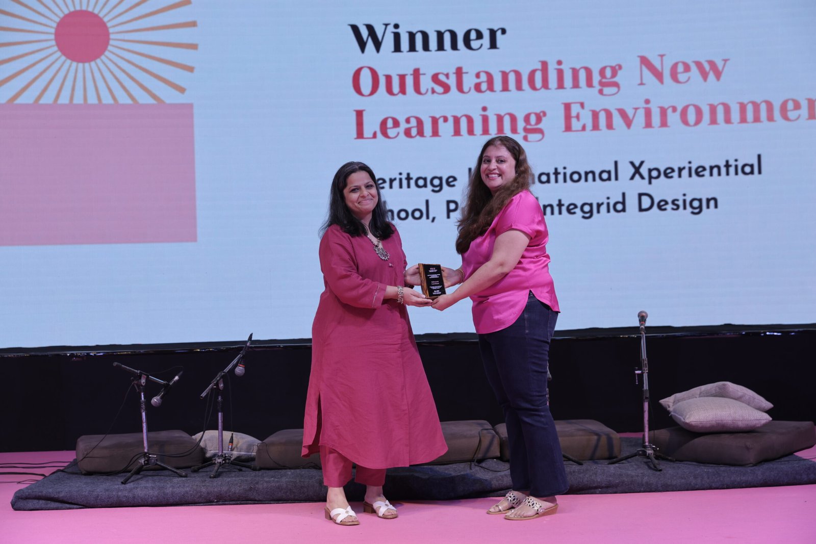 Integrid Design receiving the Outstanding New Learning Environment award on stage at the PULSE 2026 Gala