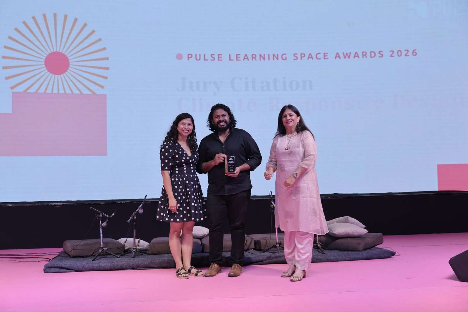 Nevin Victor receiving the Jury Citation for Climate Responsive Design on stage at the PULSE 2026 Gala